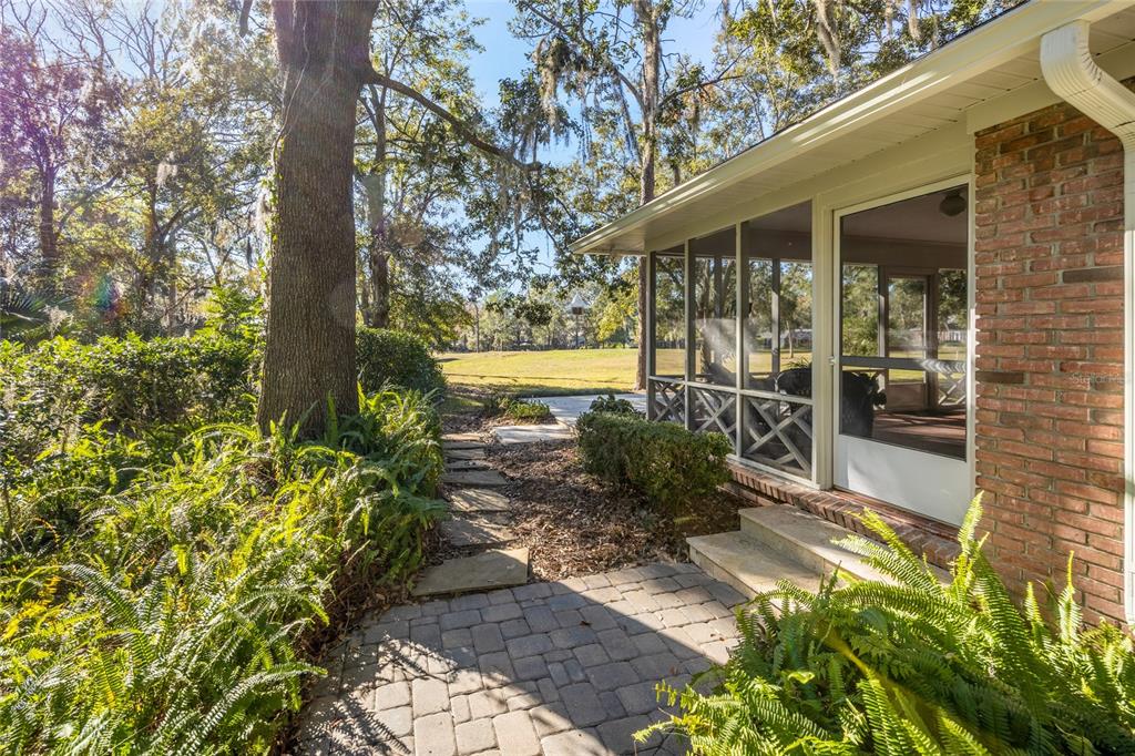 5808 Southwest 35th Way Gainesville, FL 32608 - Photo 46 of 54 a front view of a house with a yard