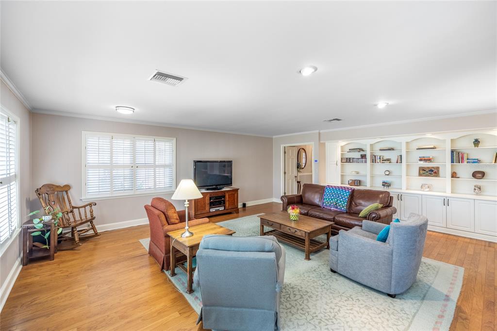 5808 Southwest 35th Way Gainesville, FL 32608 - Photo 5 of 54 a living room with furniture and a flat screen tv