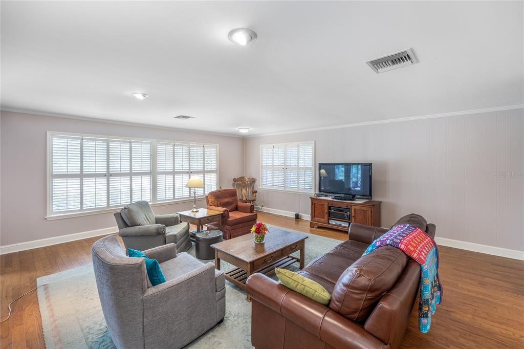 5808 Southwest 35th Way Gainesville, FL 32608 - Photo 6 of 54 a living room with furniture and a flat screen tv