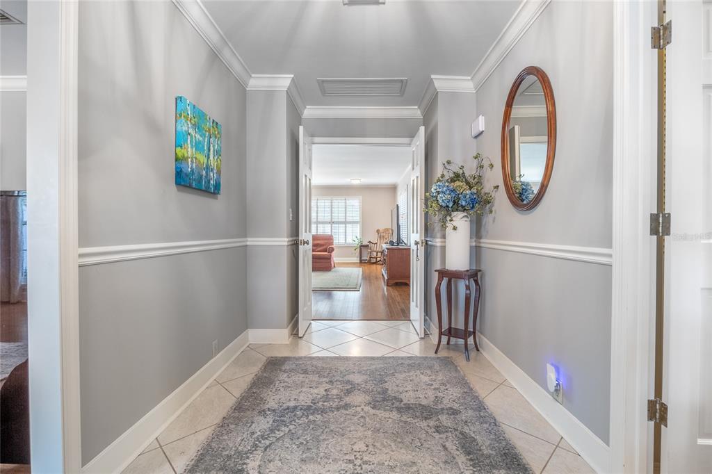 5808 Southwest 35th Way Gainesville, FL 32608 - Photo 7 of 54 a view of entryway with wooden floor and mirror