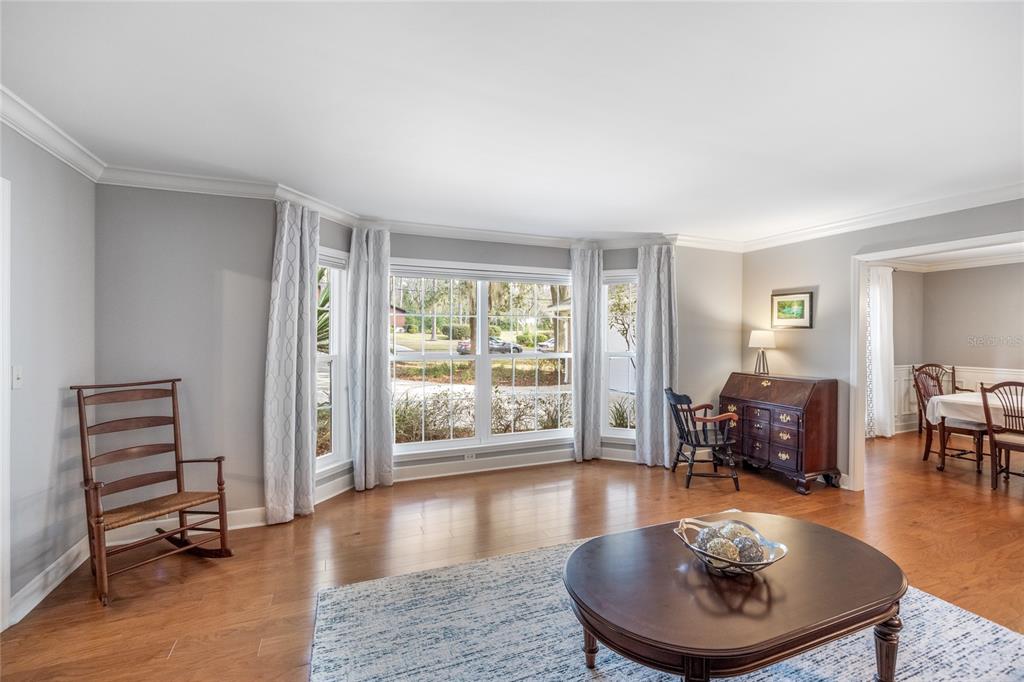 5808 Southwest 35th Way Gainesville, FL 32608 - Photo 9 of 54 a living room with furniture and a wooden floor