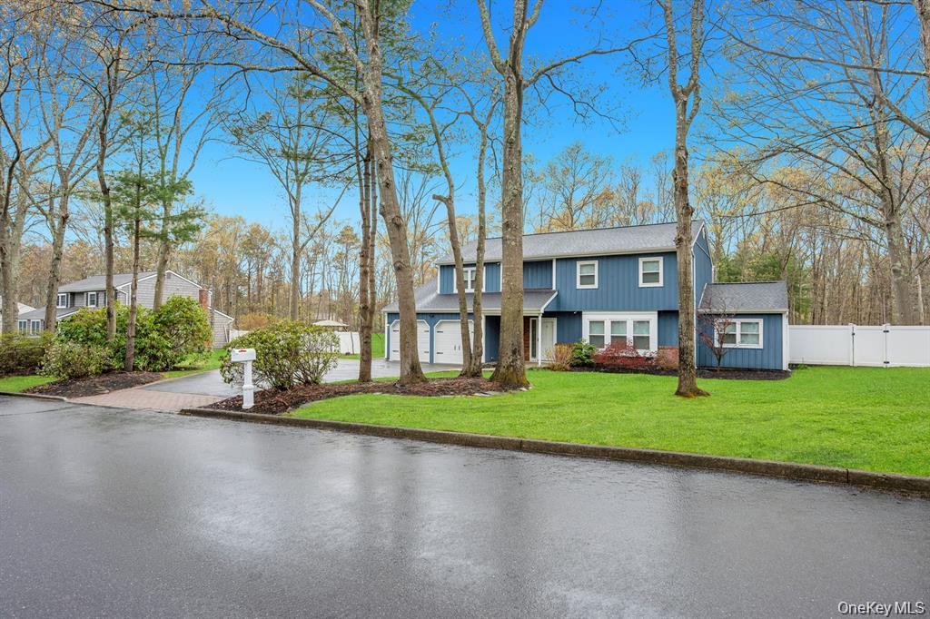 10 Ramblewood Road Ridge, NY 11961 - Photo 4 of 39 a backyard of a house with barbeque oven