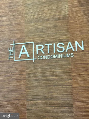 a sign that is on a brick wall