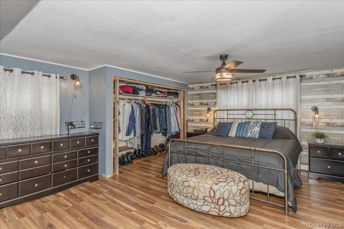 86 Oceanview Avenue Valley Stream, NY 11581 - Photo 13 of 21 a bedroom with a bed and a dresser