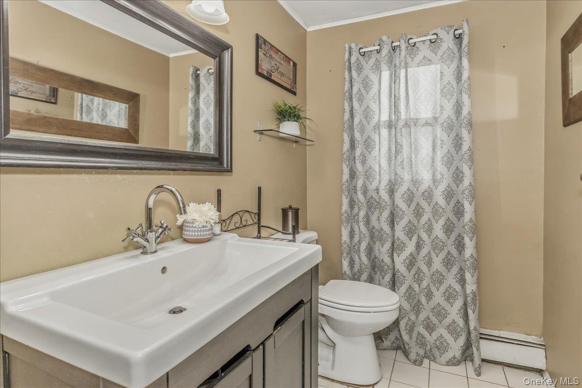 86 Oceanview Avenue Valley Stream, NY 11581 - Photo 14 of 21 a bathroom with a sink toilet and shower