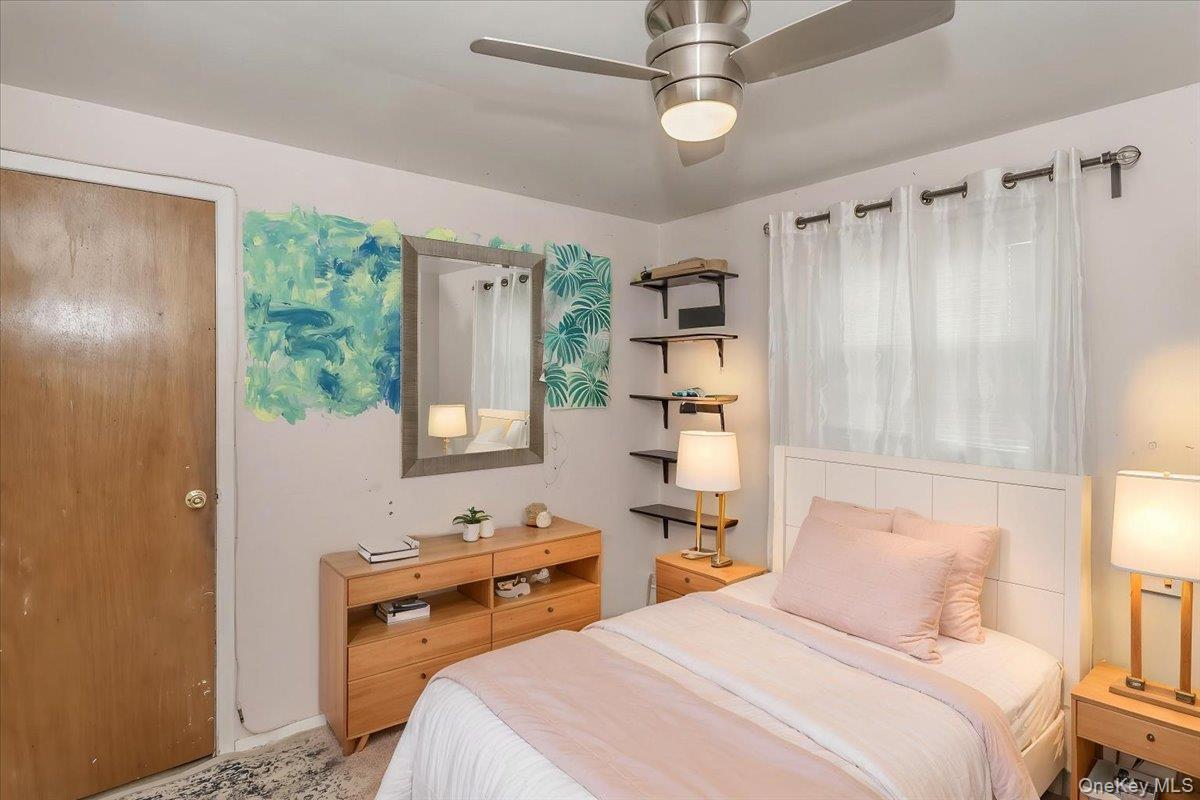 86 Oceanview Avenue Valley Stream, NY 11581 - Photo 15 of 21 a bedroom with a bed and a window