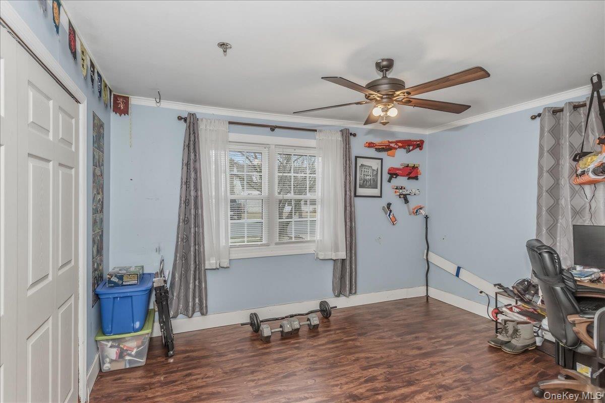 86 Oceanview Avenue Valley Stream, NY 11581 - Photo 17 of 21 a view of workspace with wooden floor and windows