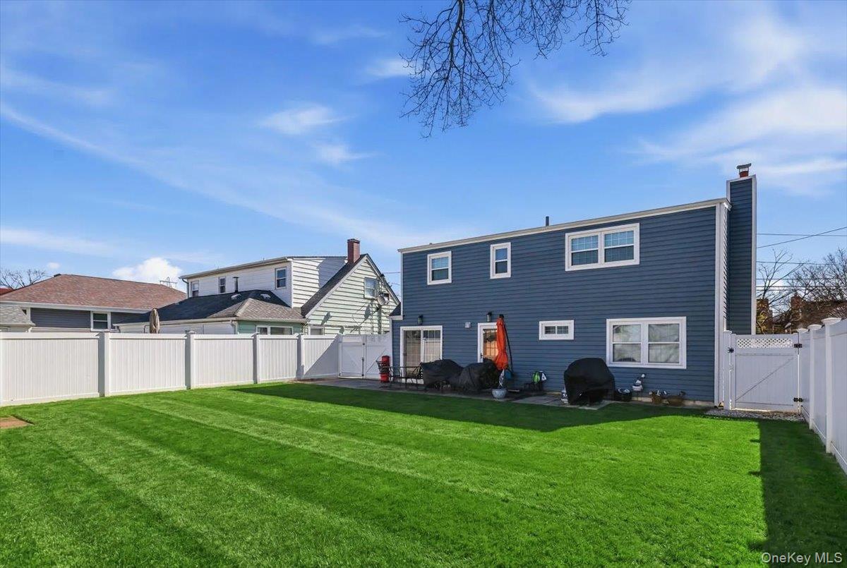 86 Oceanview Avenue Valley Stream, NY 11581 - Photo 21 of 21 a front view of a house with a yard