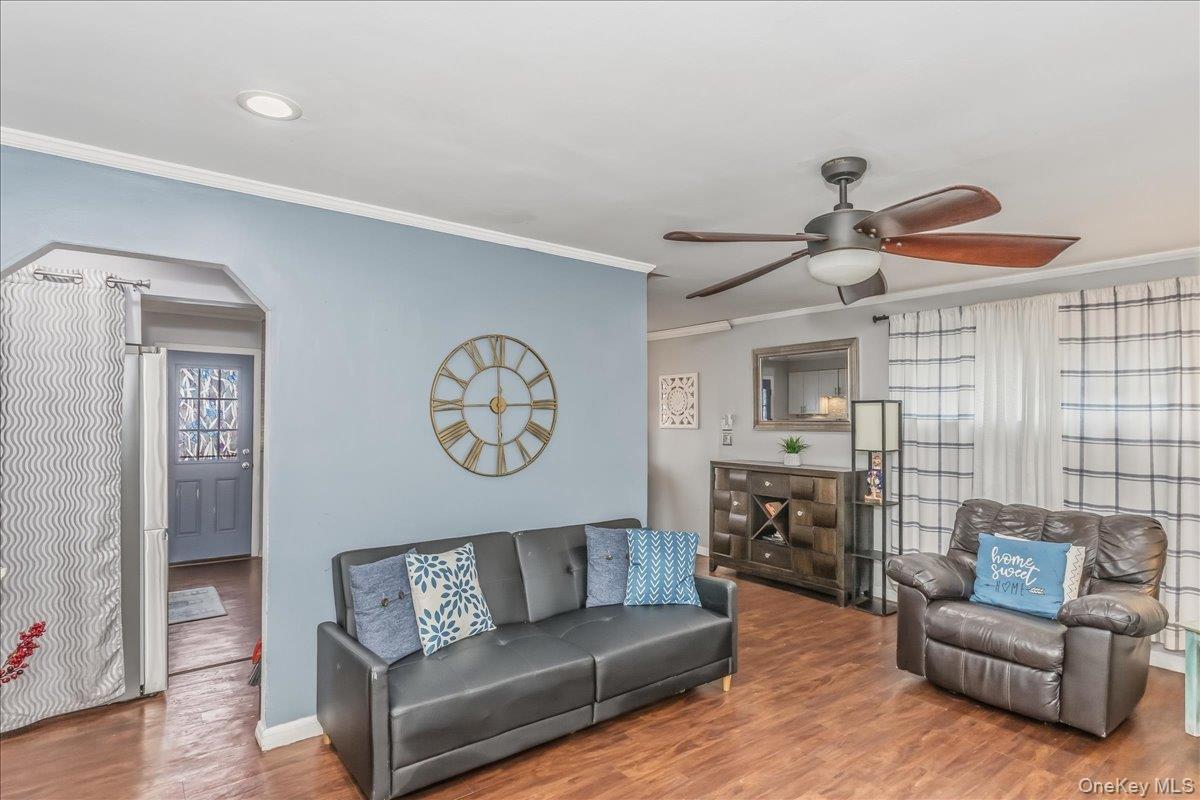 86 Oceanview Avenue Valley Stream, NY 11581 - Photo 3 of 21 a living room with furniture and a wooden floor