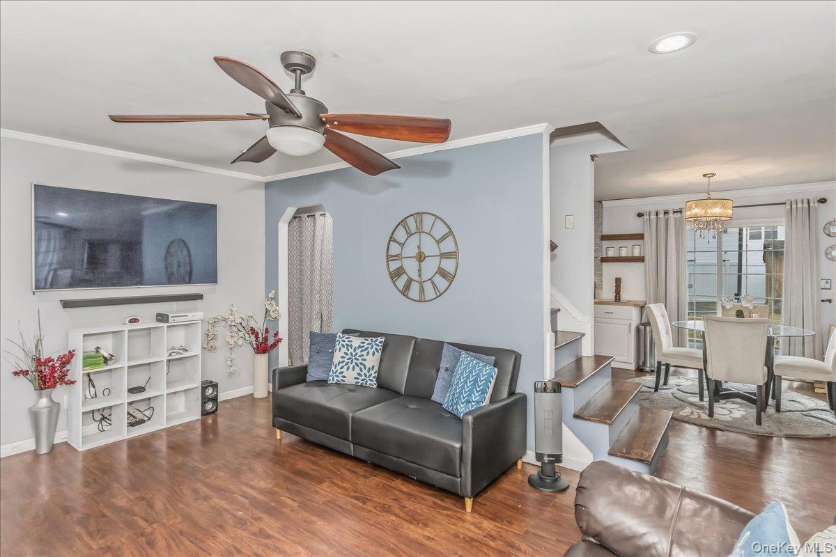 86 Oceanview Avenue Valley Stream, NY 11581 - Photo 4 of 21 a living room with furniture and a flat screen tv