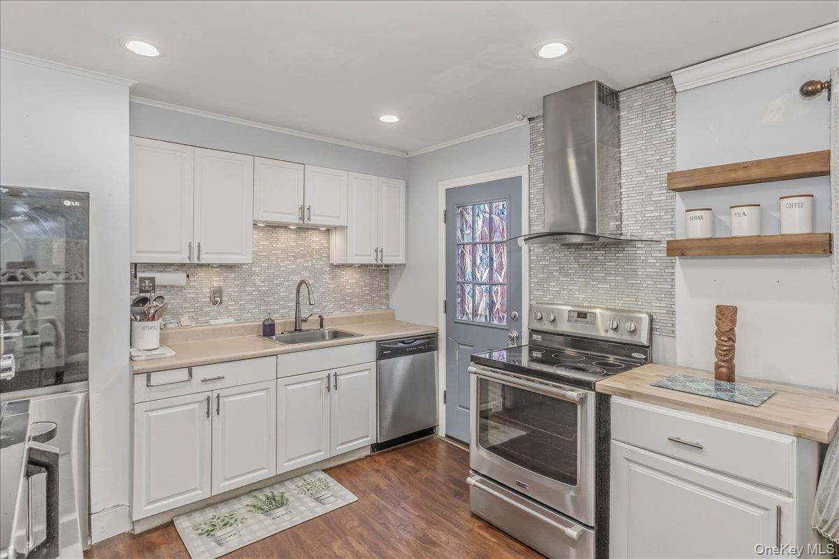 86 Oceanview Avenue Valley Stream, NY 11581 - Photo 8 of 21 a kitchen with a sink stove and cabinets