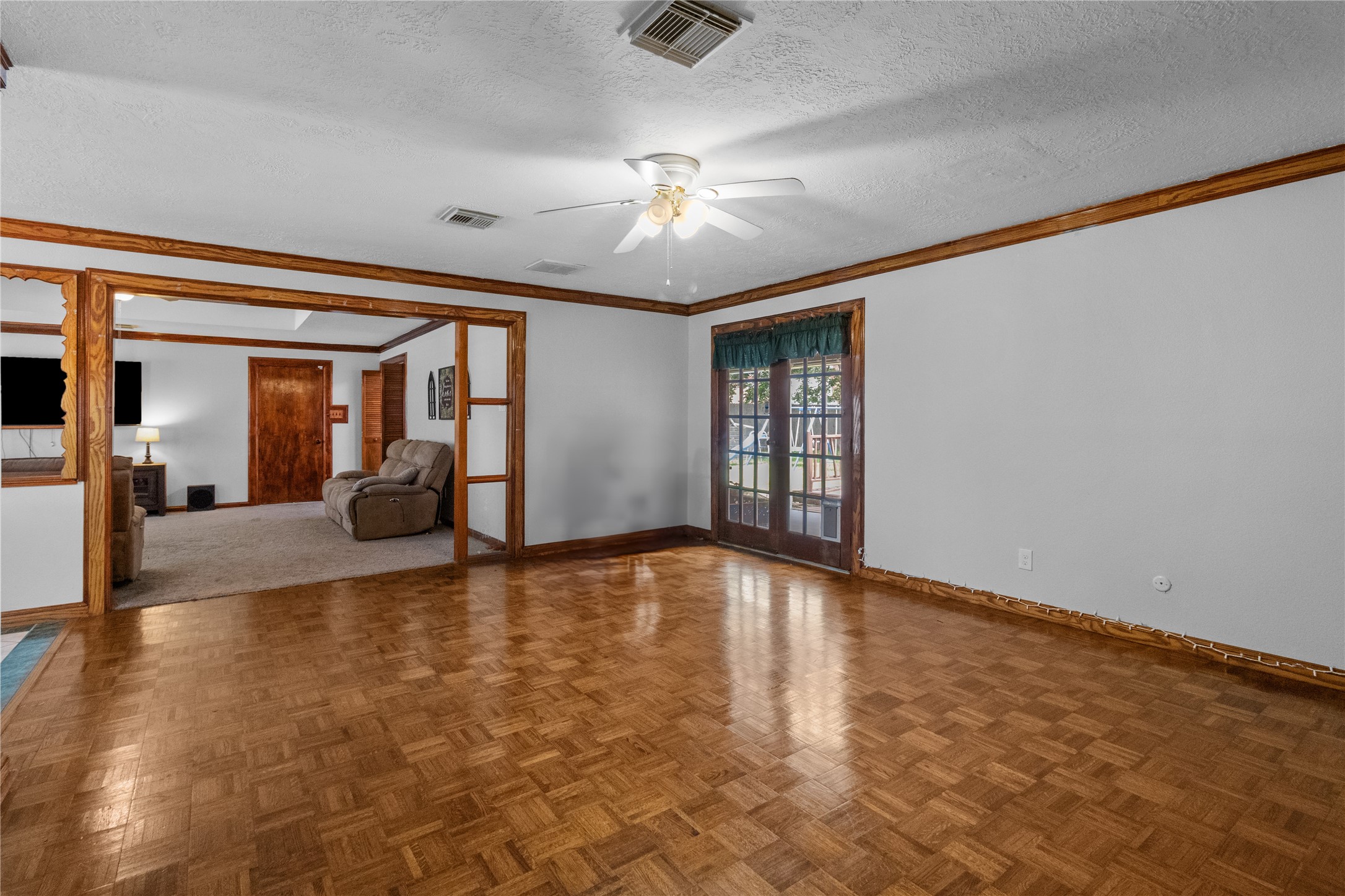 4322 Aztec Street Pasadena, TX 77504 - Photo 9 of 17 This bright and versatile living space with wood floors and French doors to the backyard is perfect for a formal sitting area, playroom—ready to adapt to your lifestyle.