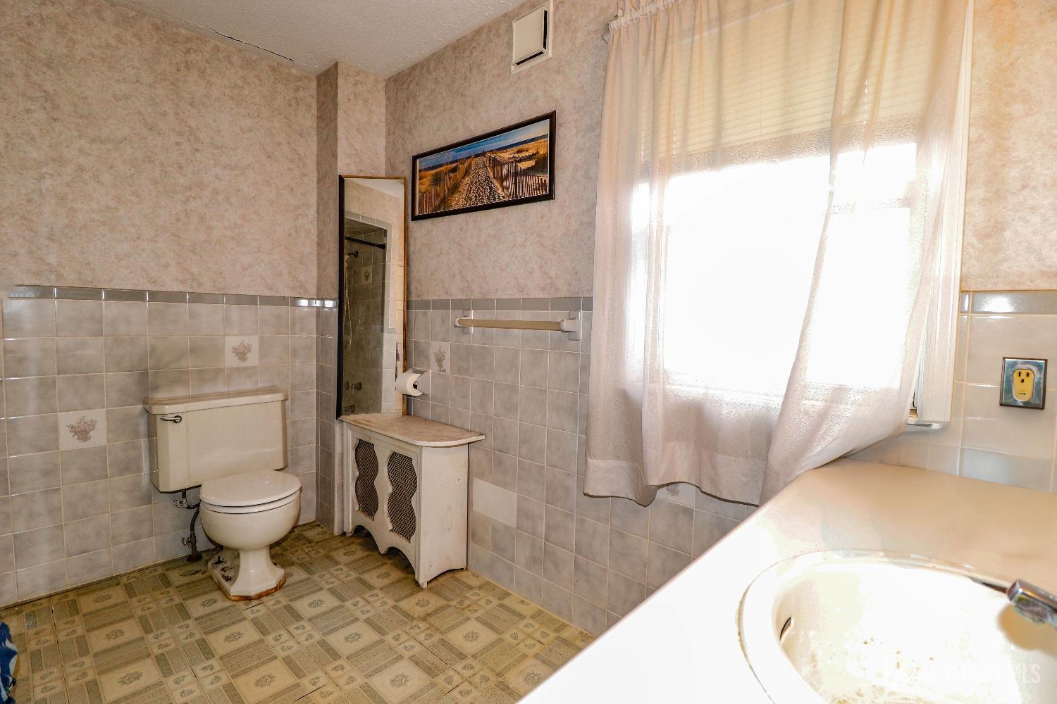 484 Old Post Road Edison, NJ 08817 - Photo 11 of 19 a bathroom with a toilet and a sink