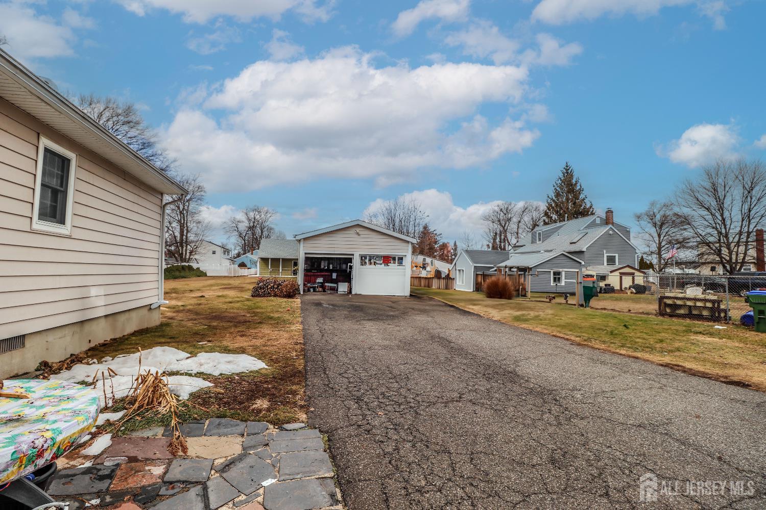 484 Old Post Road Edison, NJ 08817 - Photo 3 of 19 a front view of a house with a yard