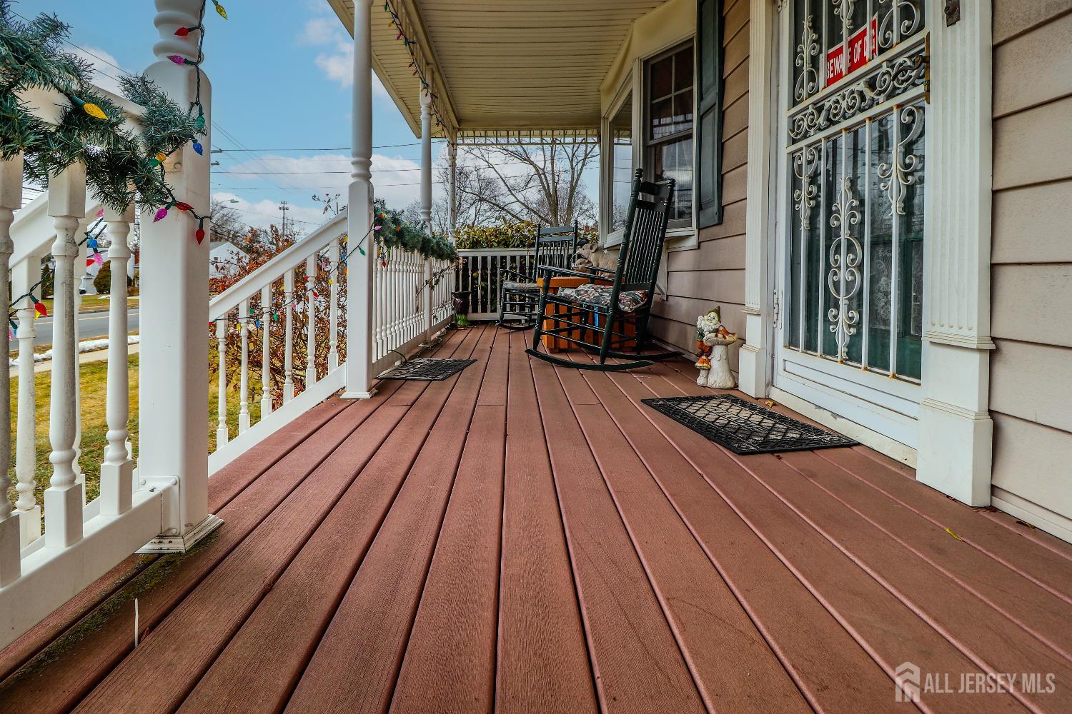 484 Old Post Road Edison, NJ 08817 - Photo 5 of 19 a view of deck with wooden floor and outdoor seating