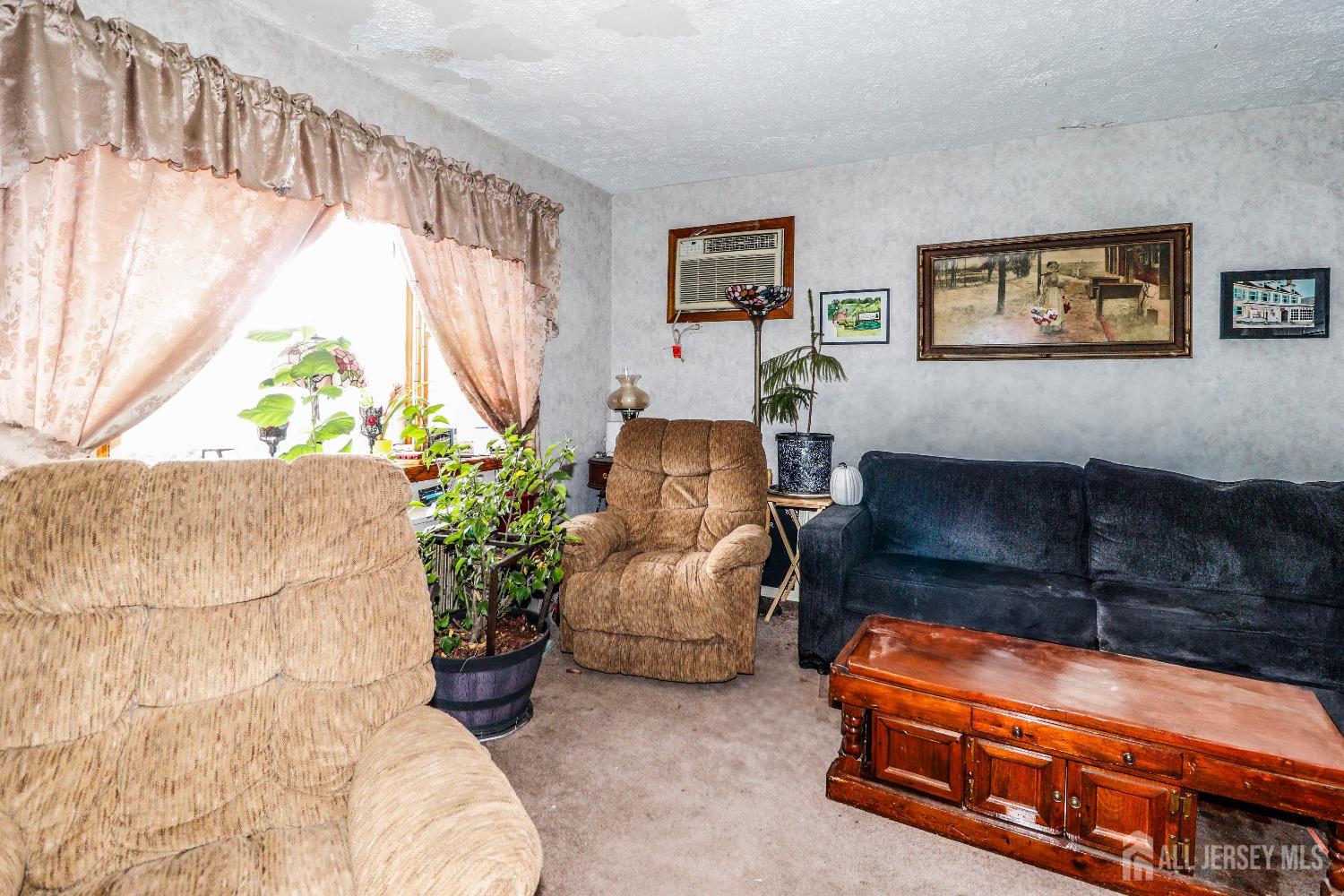 484 Old Post Road Edison, NJ 08817 - Photo 8 of 19 a living room with furniture and a window