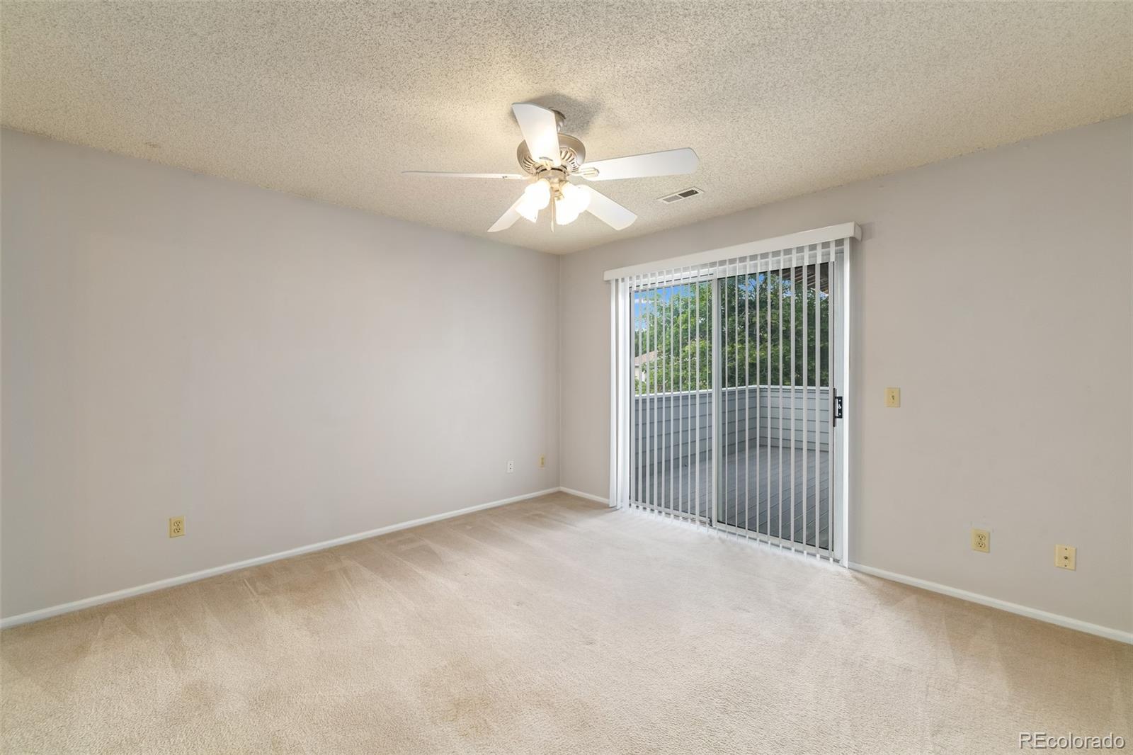 8449 Everett Way, Unit E Arvada, CO 80005 - Photo 14 of 25 a view of an empty room with a window
