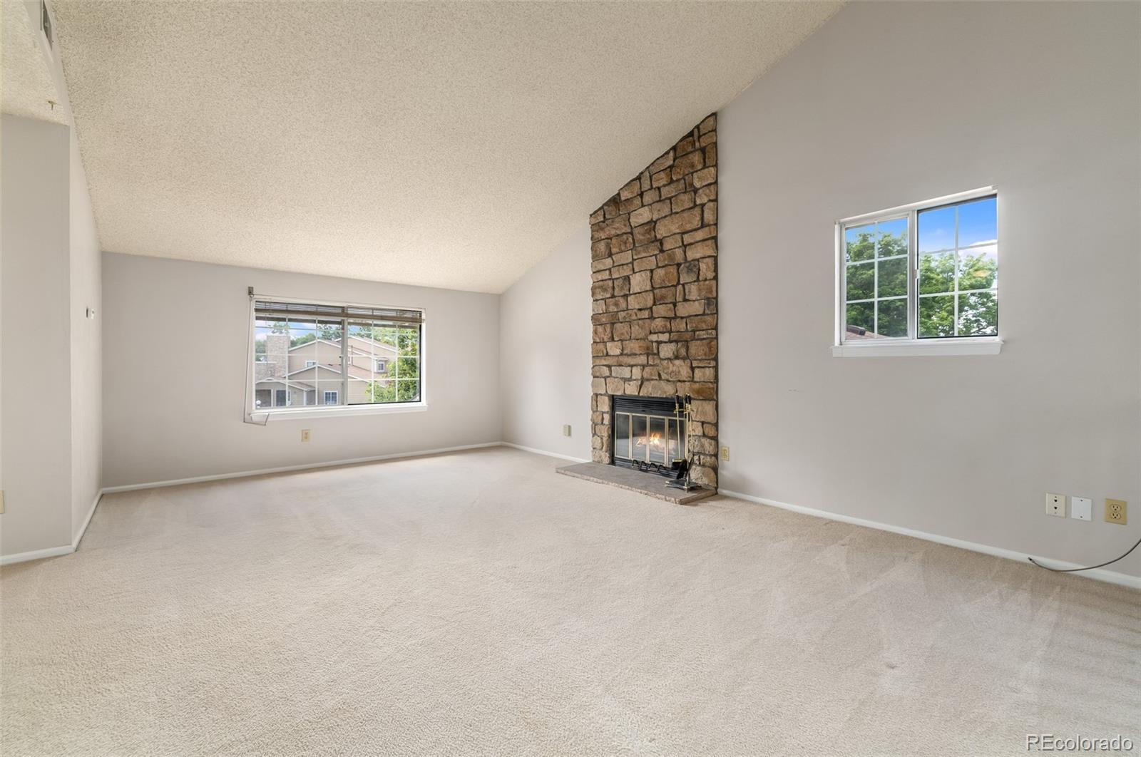 8449 Everett Way, Unit E Arvada, CO 80005 - Photo 5 of 25 an empty room with windows