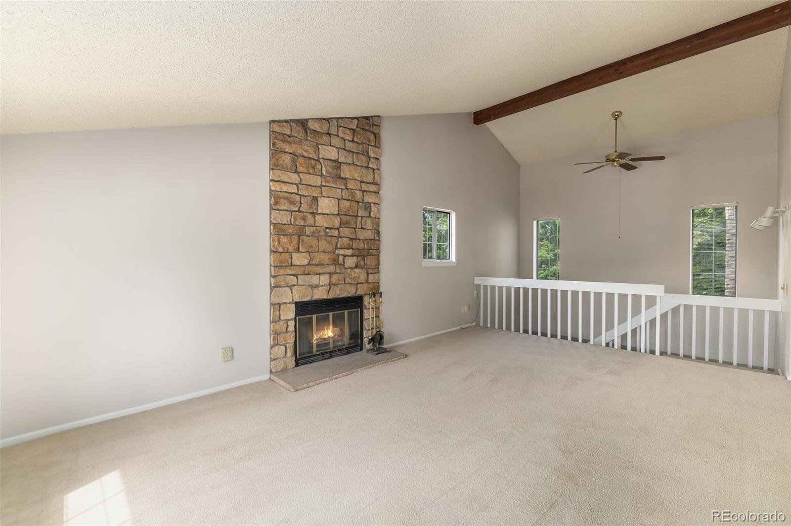 8449 Everett Way, Unit E Arvada, CO 80005 - Photo 7 of 25 a view of an empty room with a fireplace