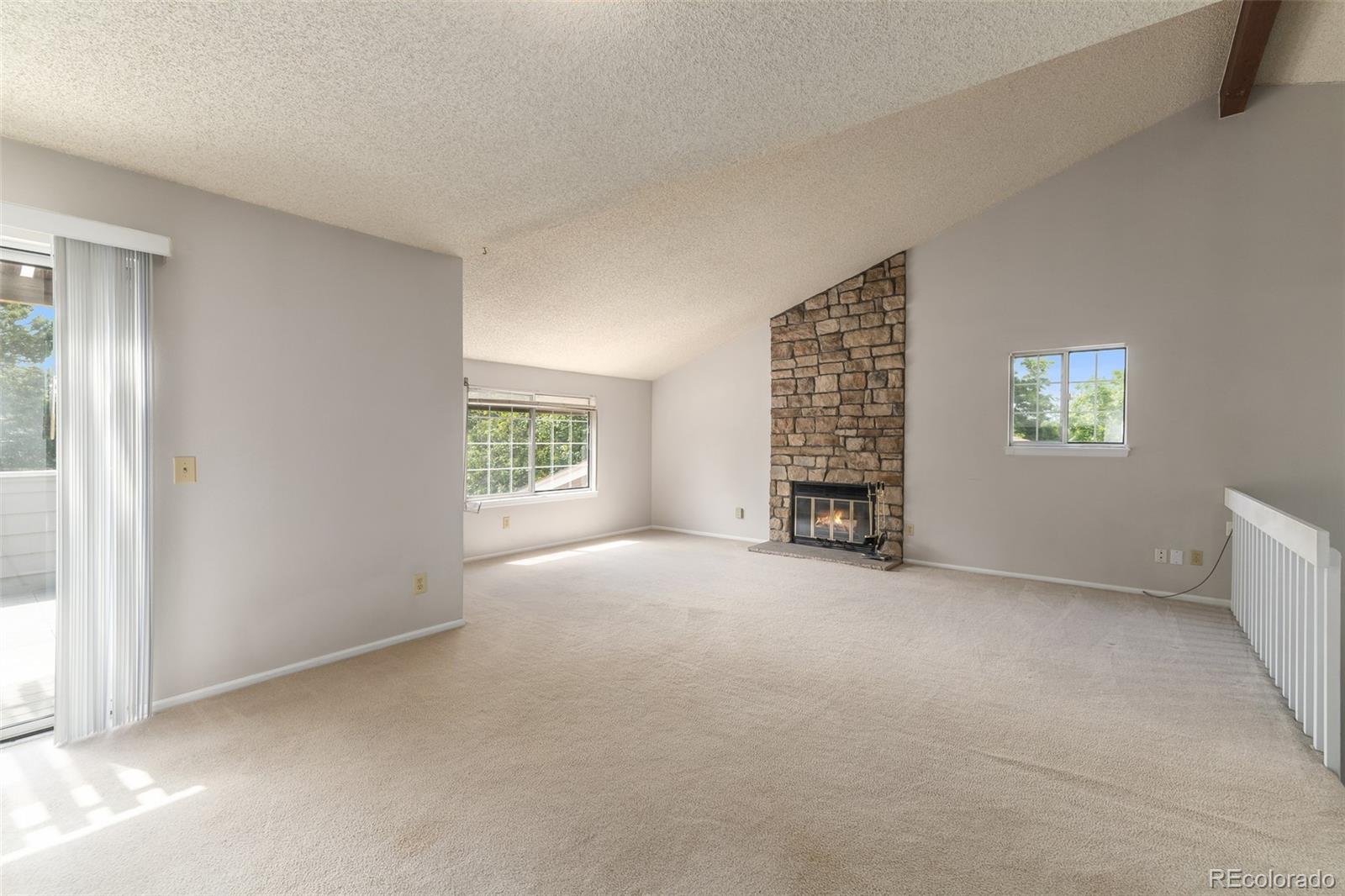 8449 Everett Way, Unit E Arvada, CO 80005 - Photo 9 of 25 a view of an empty room with a window
