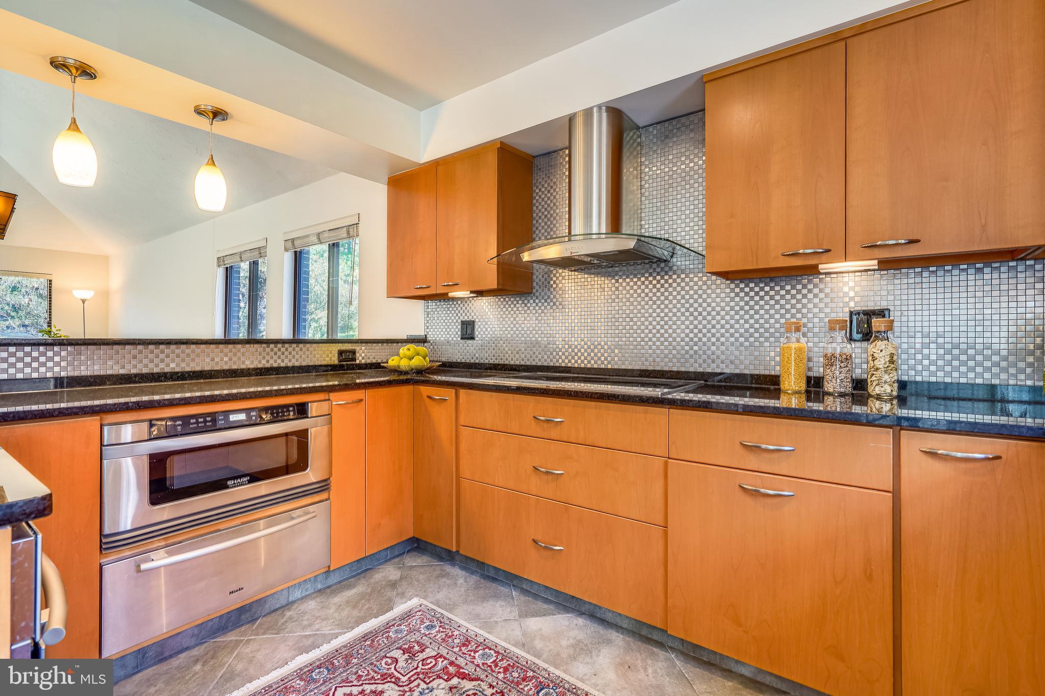 11310 Harborside Cluster Reston, VA 20191 - Photo 8 of 31 Stunning stainless-steel backsplash