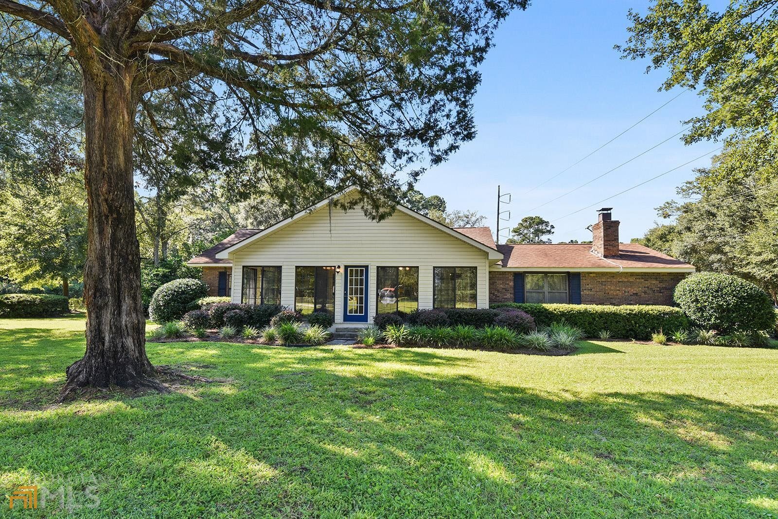 1703 Point Peter Road St. Marys, GA 31558 - Photo 1 of 1 a front view of a house with garden