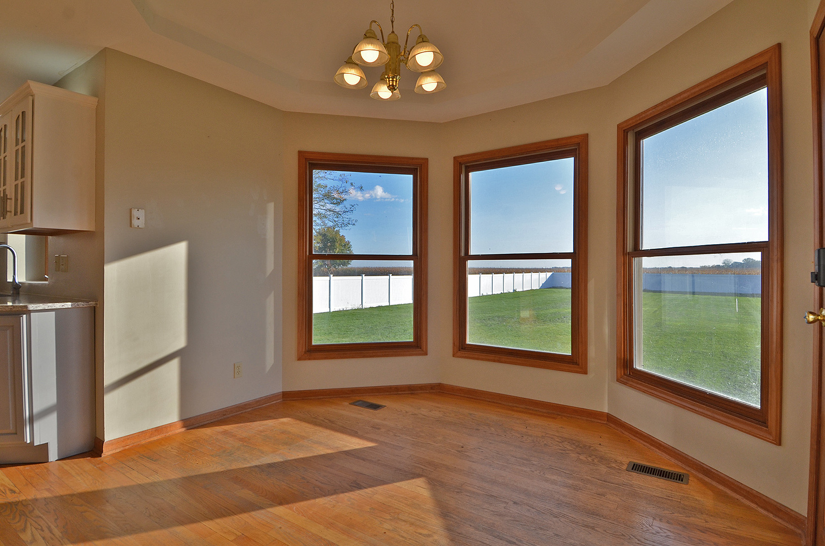 3618 East 1769th Road Ottawa, IL 61350 - Photo 12 of 36 a view of an empty room with a window and wooden floor