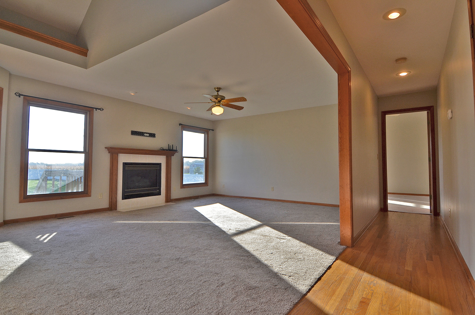3618 East 1769th Road Ottawa, IL 61350 - Photo 5 of 36 a view of an empty room with a fireplace and a window