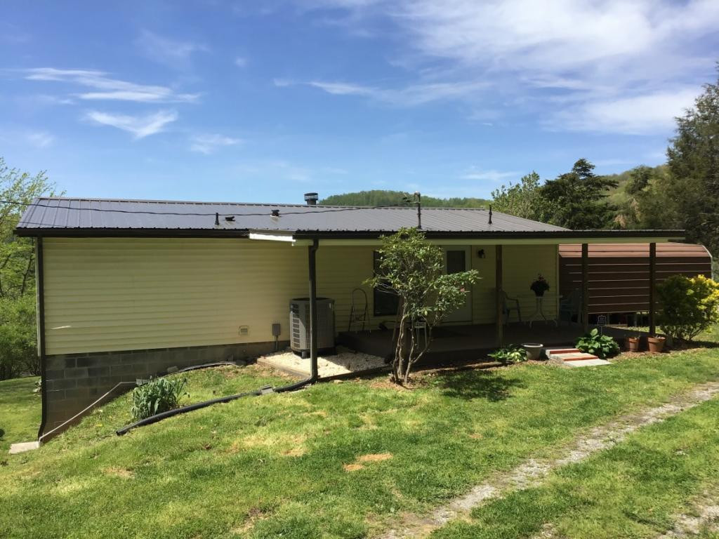 3609 Bishoptown Road Duffield, VA 24244 - Photo 19 of 25 Covered back porch metal roof