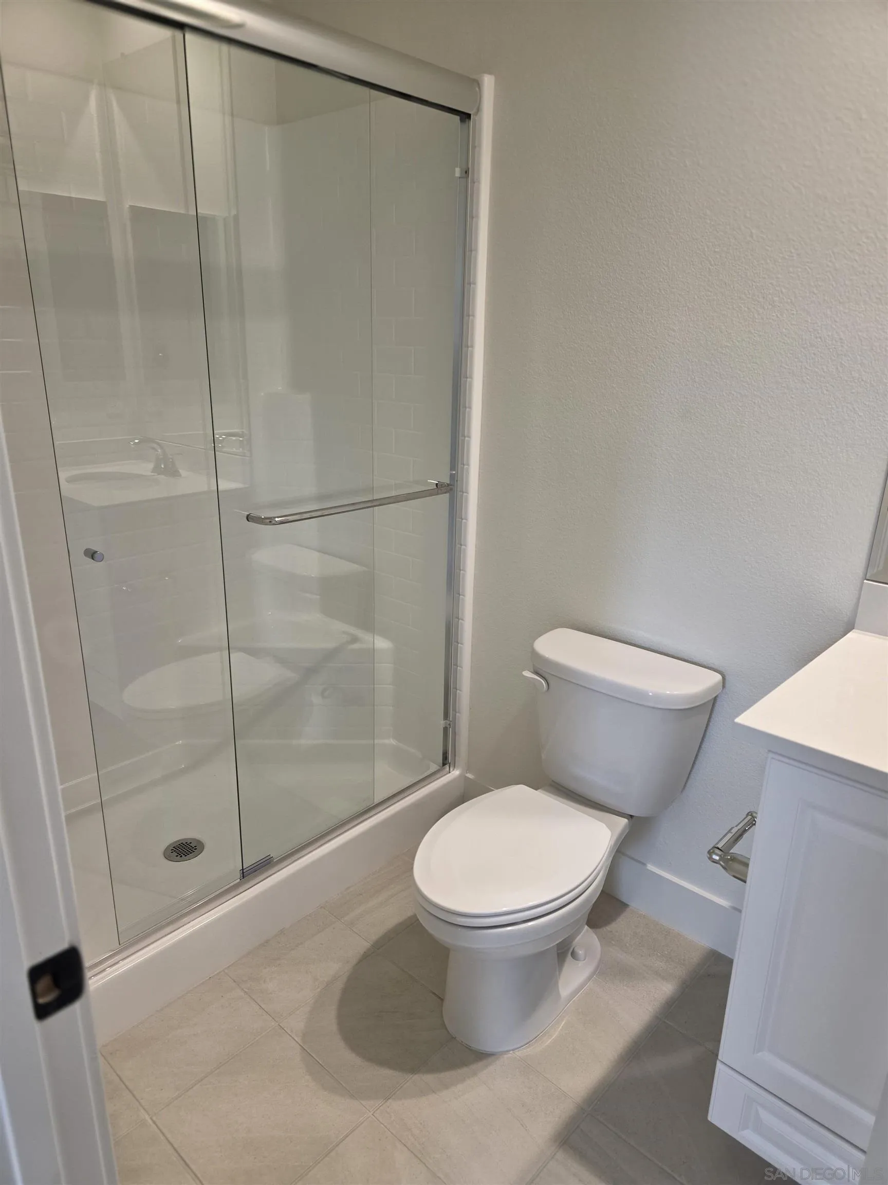 3140 Smith Place Escondido, CA 92027 - Photo 4 of 19 a white toilet sitting next to a bathroom sink