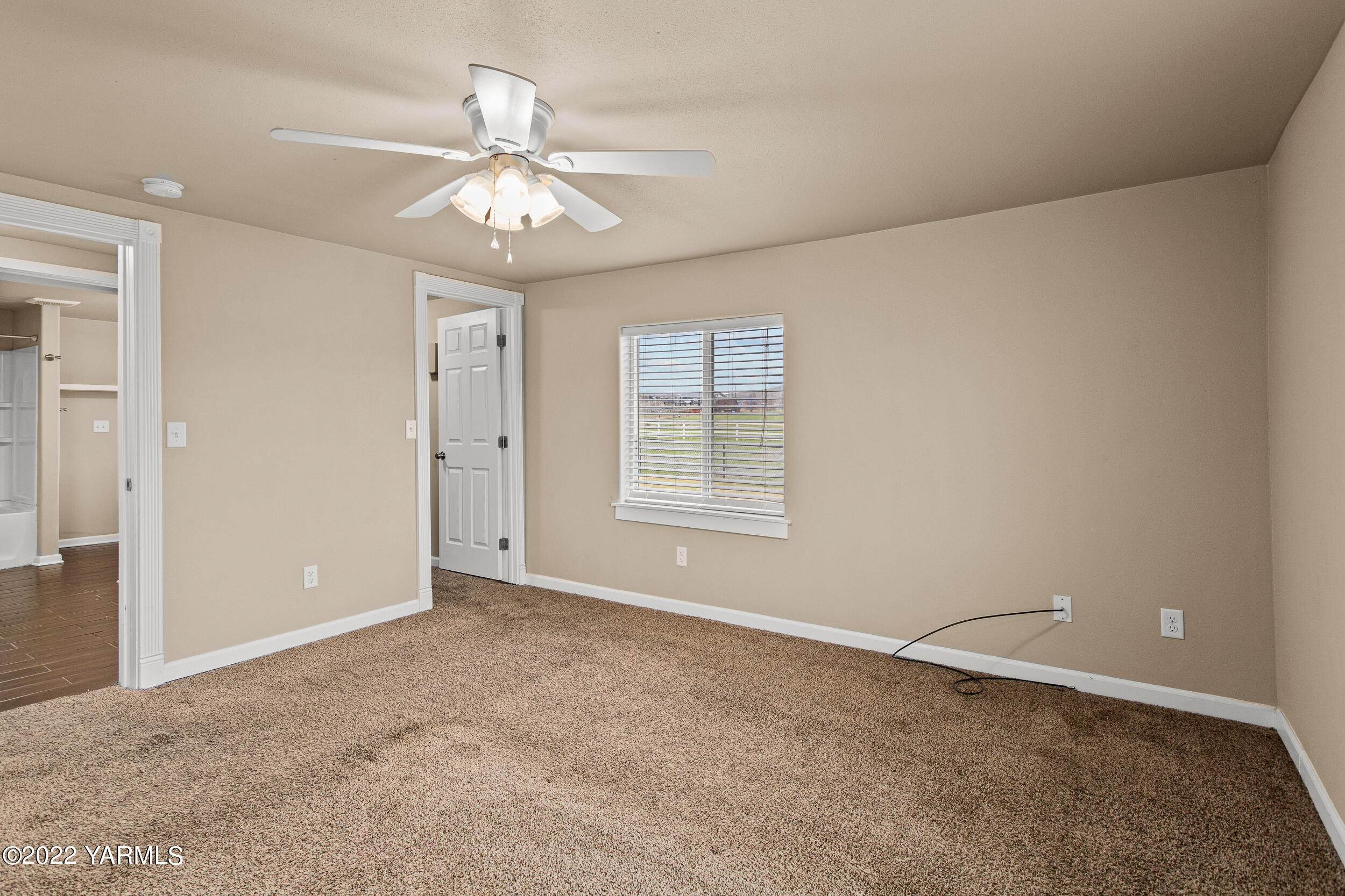 211 Wilson Road Yakima, WA 98901 - Photo 11 of 35 a view of an empty room with a window