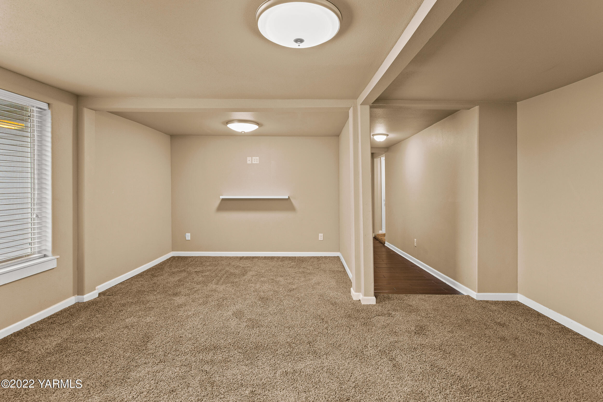 211 Wilson Road Yakima, WA 98901 - Photo 18 of 35 an empty room with wooden floor and windows