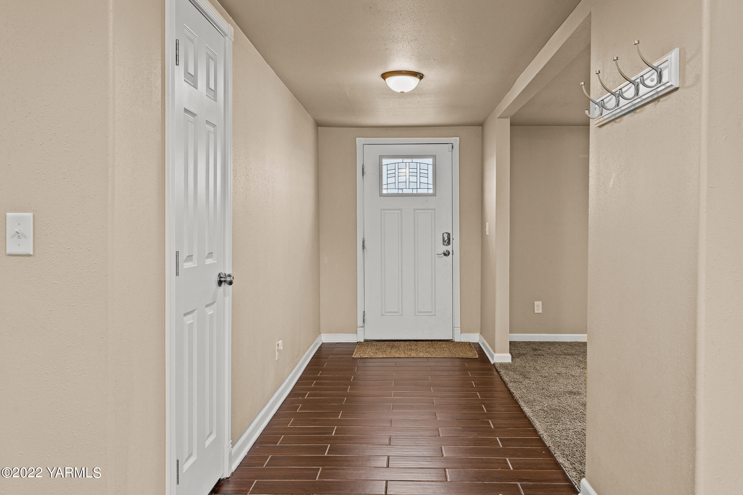 211 Wilson Road Yakima, WA 98901 - Photo 2 of 35 a view of a hallway with wooden floor
