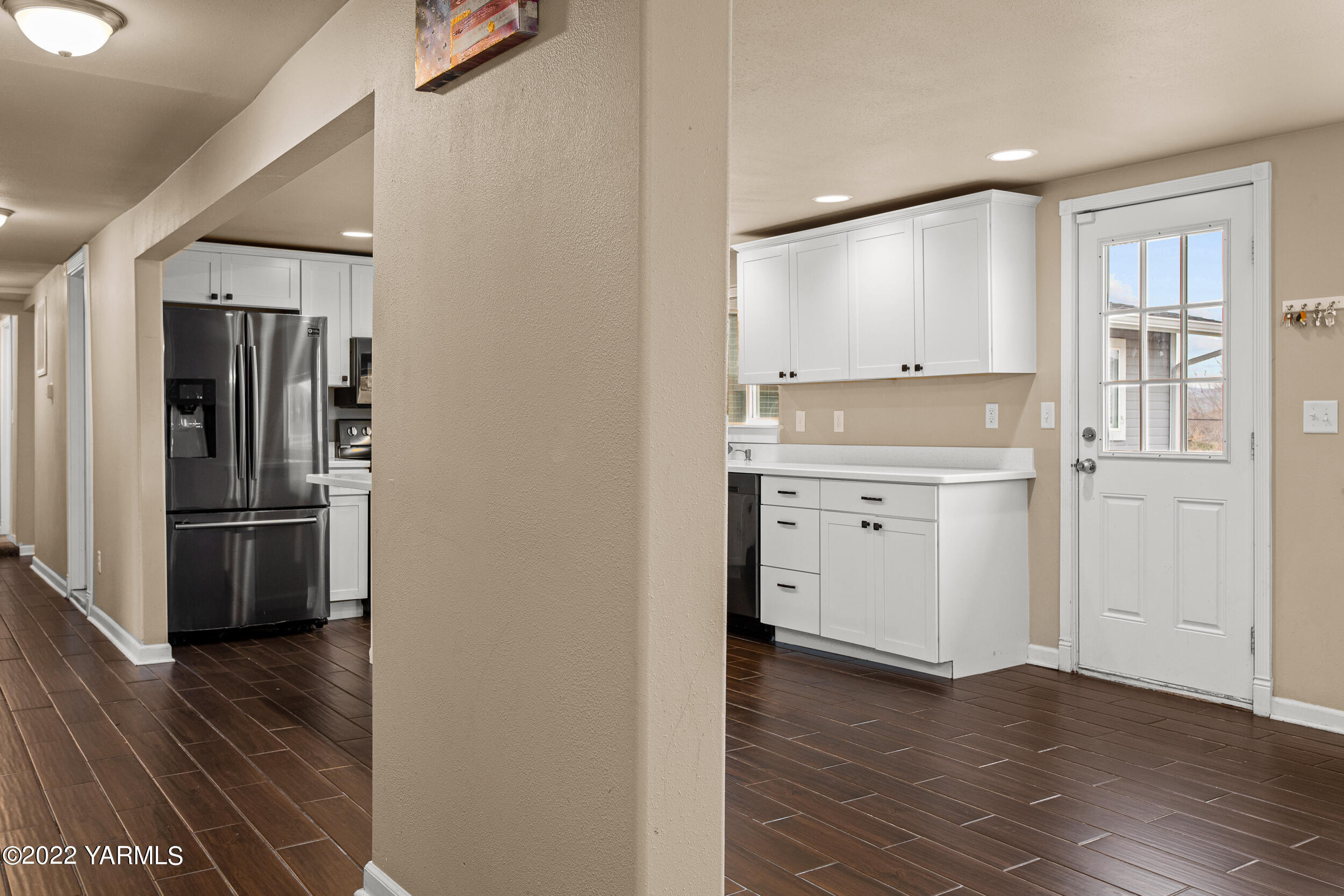 211 Wilson Road Yakima, WA 98901 - Photo 5 of 35 a view of a kitchen with a refrigerator a stove top oven and sink