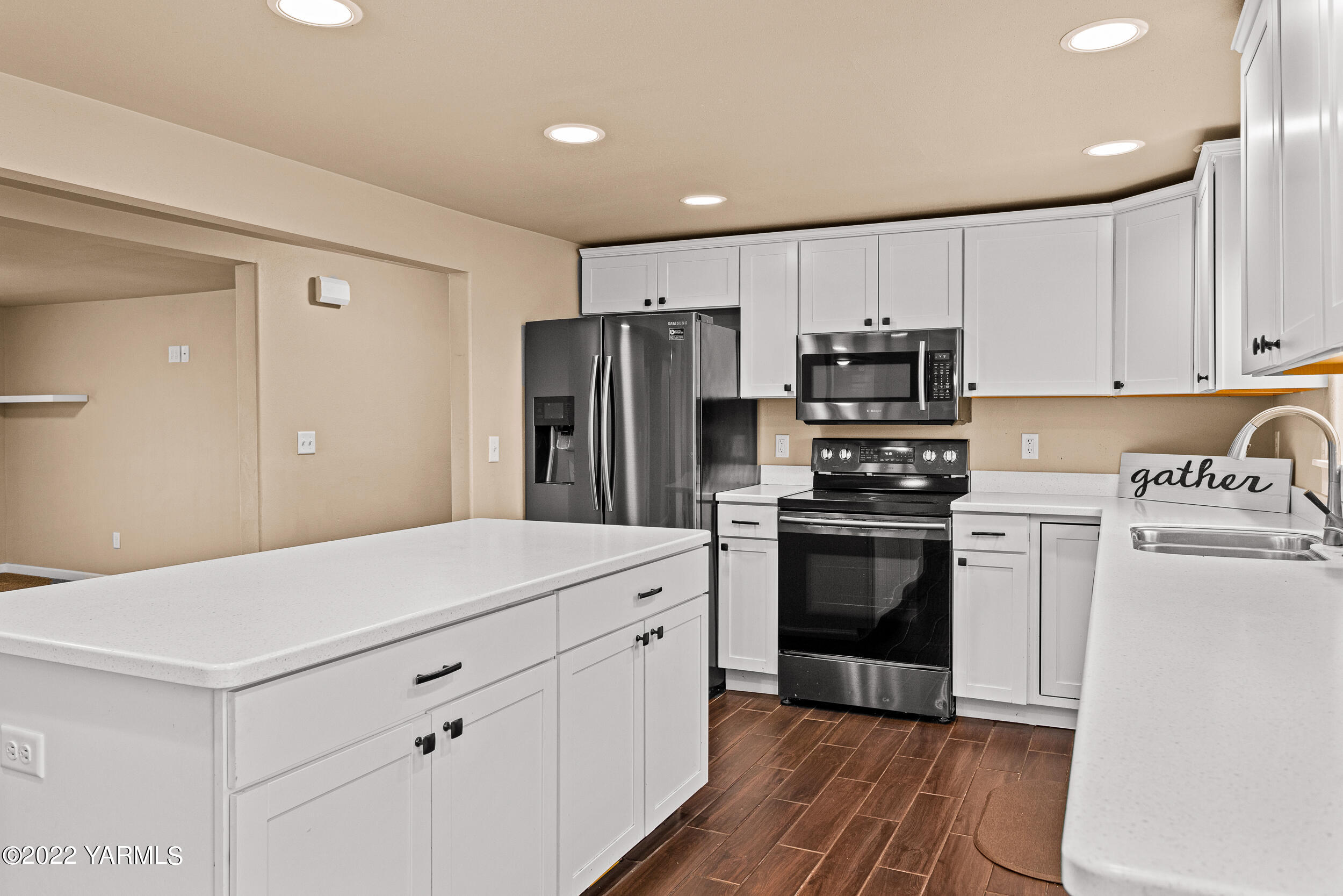 211 Wilson Road Yakima, WA 98901 - Photo 8 of 35 a kitchen with stainless steel appliances a refrigerator sink and cabinets