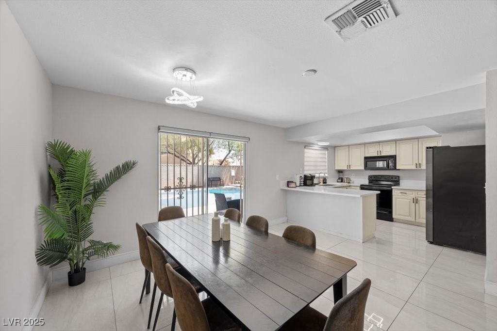 3618 Redwood Street Las Vegas, NV 89103 - Photo 12 of 57 The open-concept design effortlessly connects the kitchen and living room, making entertaining and everyday living a breeze.