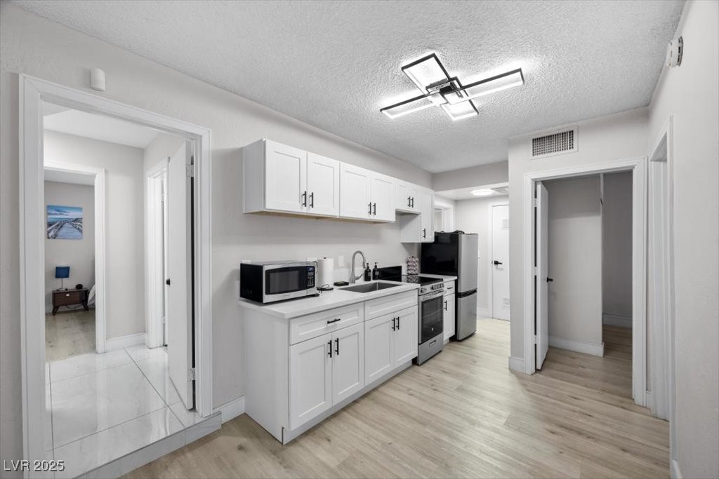 3618 Redwood Street Las Vegas, NV 89103 - Photo 16 of 57 Tastefully updated casita kitchen with a warm, welcoming vibe.