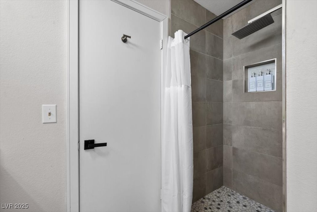 3618 Redwood Street Las Vegas, NV 89103 - Photo 23 of 57 Primary bathroom with sleek walk-in shower and modern finishes.