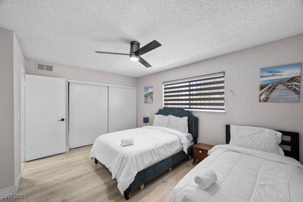3618 Redwood Street Las Vegas, NV 89103 - Photo 24 of 57 Inviting 2nd bedroom with private bathroom and dual bed arrangement.