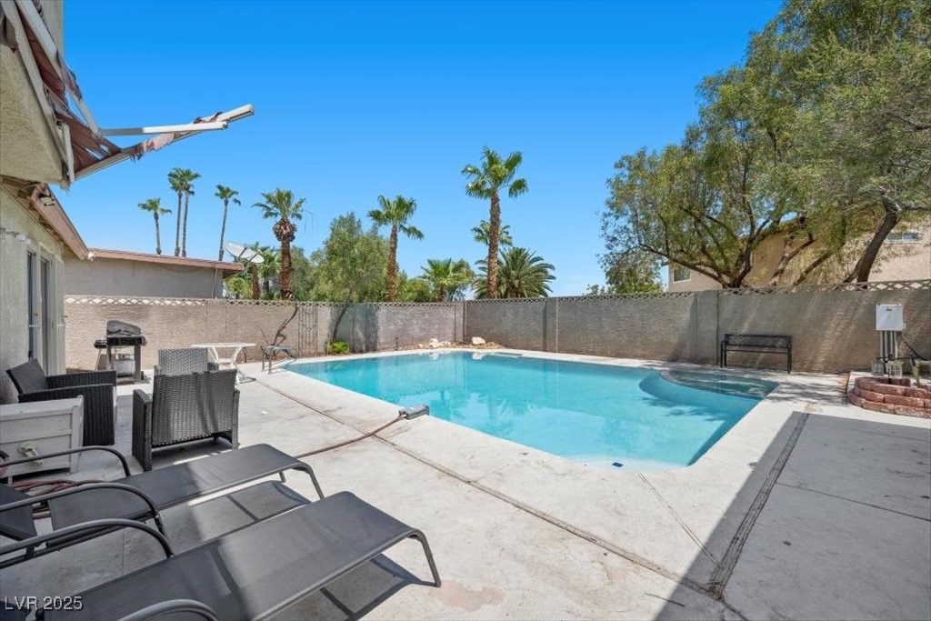 3618 Redwood Street Las Vegas, NV 89103 - Photo 39 of 57 The patio offers plenty of space for seating, making it perfect for gatherings or quiet moments outdoors.