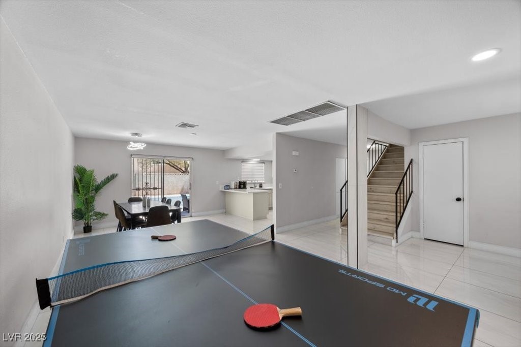 3618 Redwood Street Las Vegas, NV 89103 - Photo 7 of 57 Stylishly furnished and full of energy, this space invites connection and play.