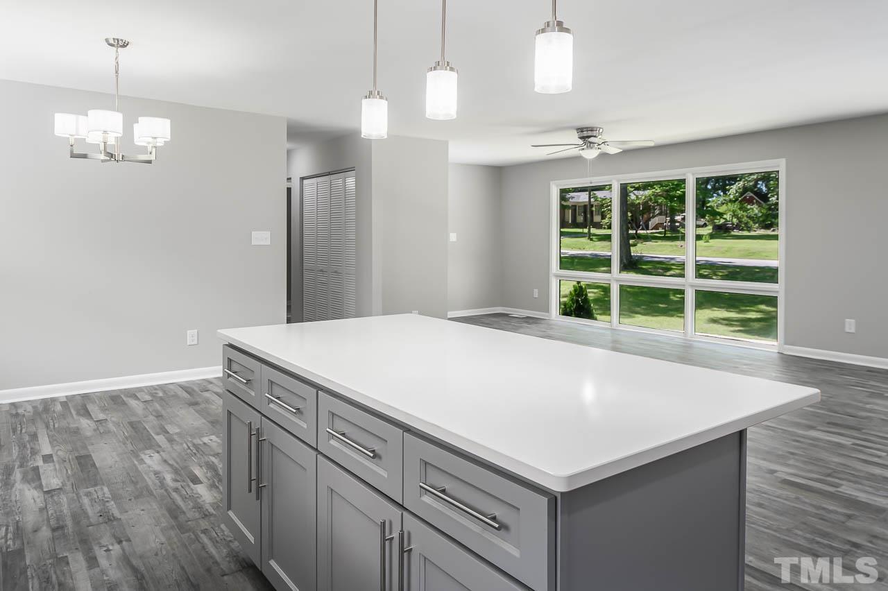 3401 Forest Road Raleigh, NC 27604 - Photo 11 of 30 a kitchen with a cabinets and chandelier