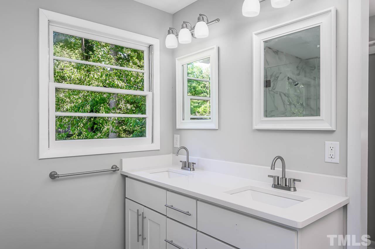 3401 Forest Road Raleigh, NC 27604 - Photo 16 of 30 a bathroom with a sink and a window