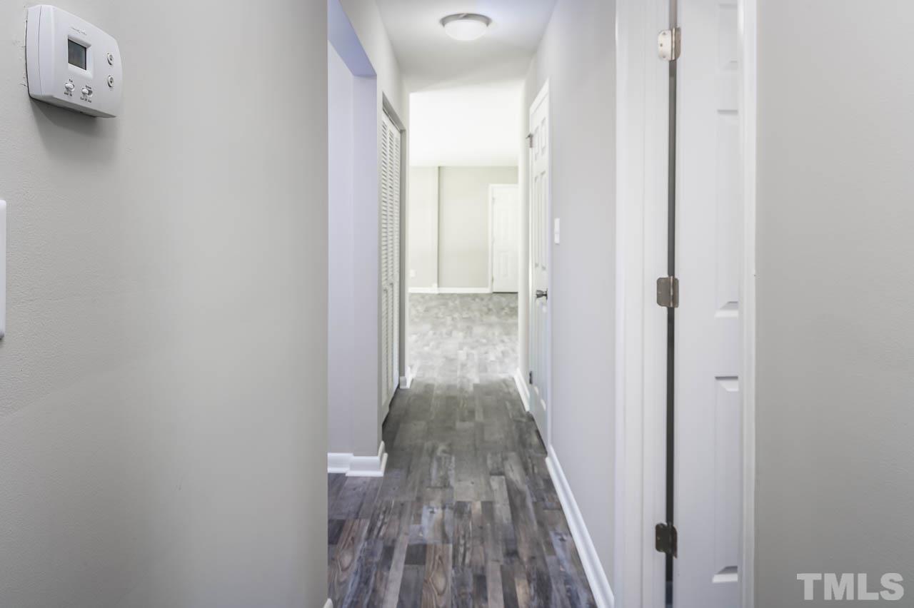 3401 Forest Road Raleigh, NC 27604 - Photo 18 of 30 a view of a hallway with wooden floor