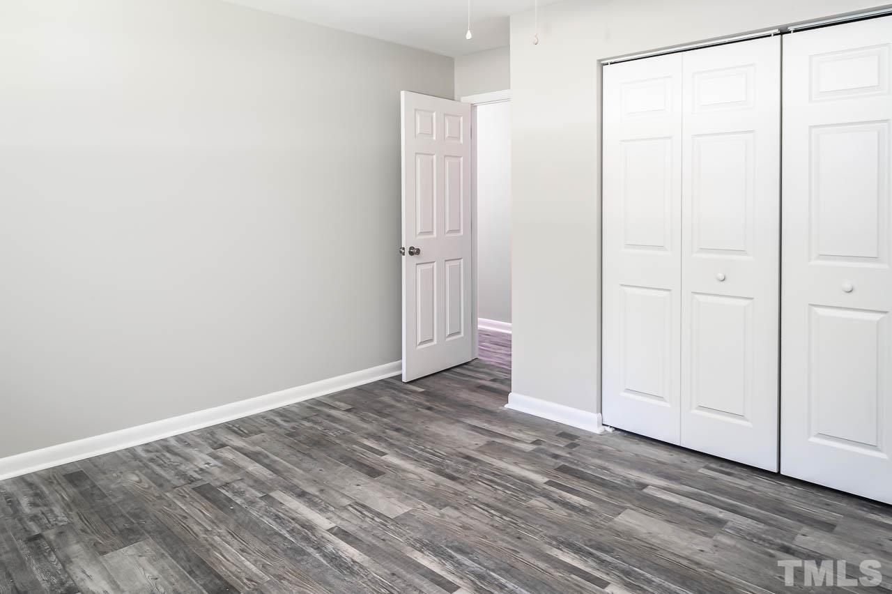 3401 Forest Road Raleigh, NC 27604 - Photo 20 of 30 a view of an empty room with wooden floor