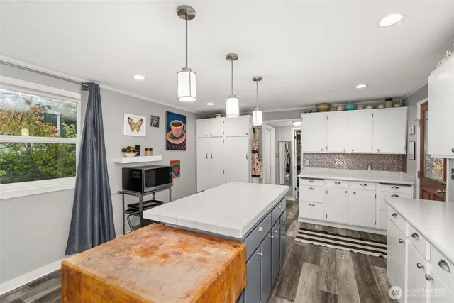 a kitchen with a stove a refrigerator and a sink