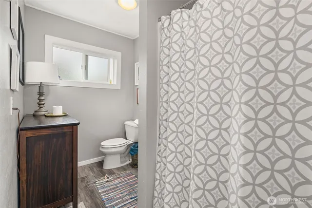 a bathroom with a white toilet and a sink