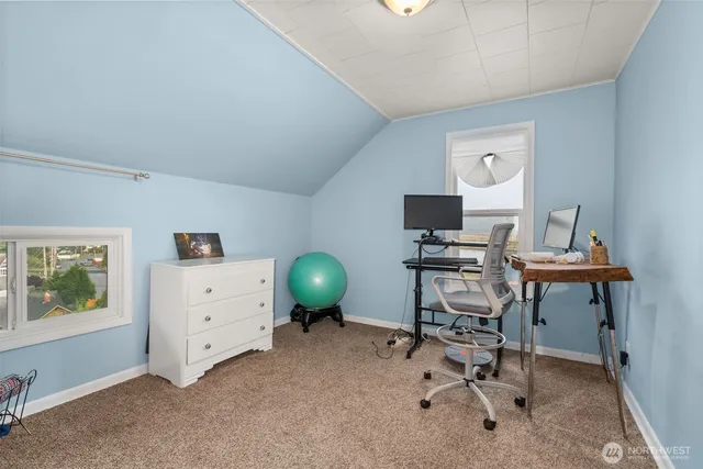 a view of a workspace with furniture