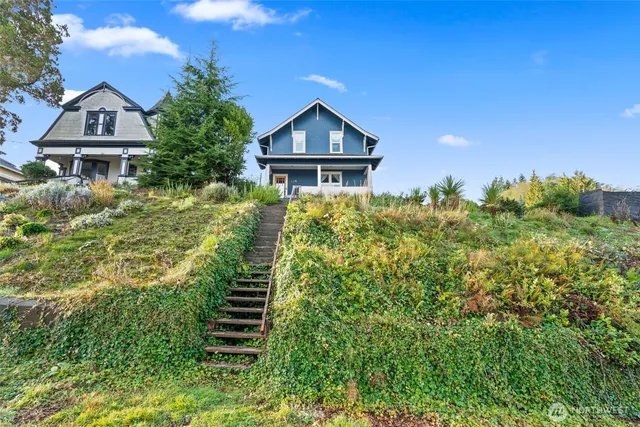 a front view of a house with a yard