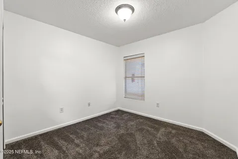 an empty room with a empty space and window